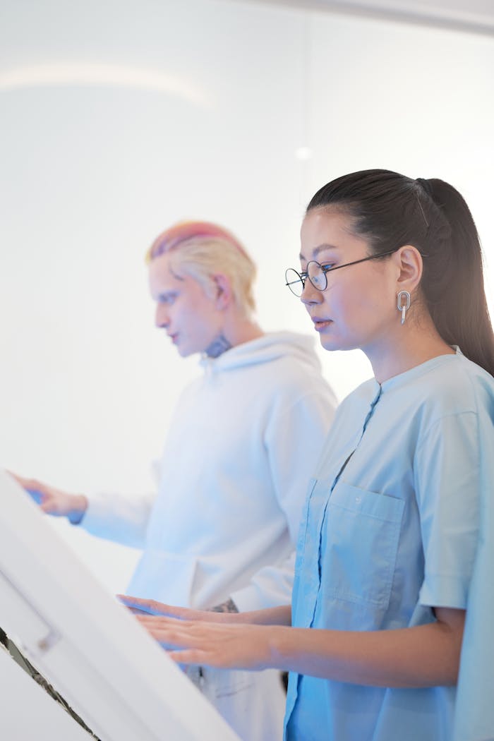 Researchers interacting with futuristic screens in a modern data center setting.